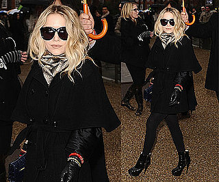 Mary-Kate Olsen at London Fashion Week Wearing Black Cape Coat and Blue Proenza Schouler Clutch