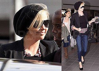 Photos of Charlize Theron Wearing Skinny Jeans and a Black Blazer and Hat at LAX
