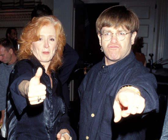 With Elton John in 1997