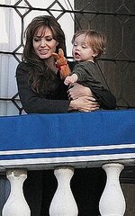 Angelina waved to fans as Knox tossed his stuffed bunny off the balcony and into the water.