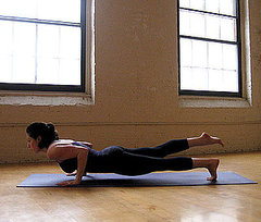 How to Do One-Legged Four-Limbed Staff Pose How to Do One-Legged Four-Limbed Staff Pose