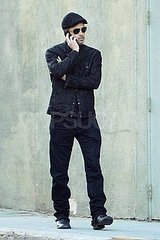 Pictures of Brad Pitt Smoking and Talking on Phone