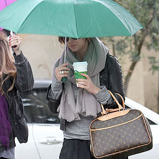 Guess Who Sheltered Her Louis Vuitton Bag From the Rain?