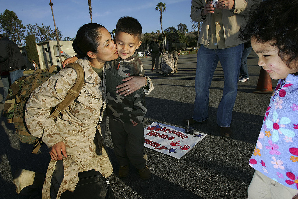 At a 2006 homecoming ceremony, Gunnery Sgt. Deborah Dangremond kisses her son, Tyler, 4, as her daughter, Basia, 3, watches on with a smile.
At a 2006 homecoming ceremony, Gunnery Sgt. Deborah Dangremond kisses her son, Tyler, 4, as her daughter, Basia, 3, watches on with a smile.