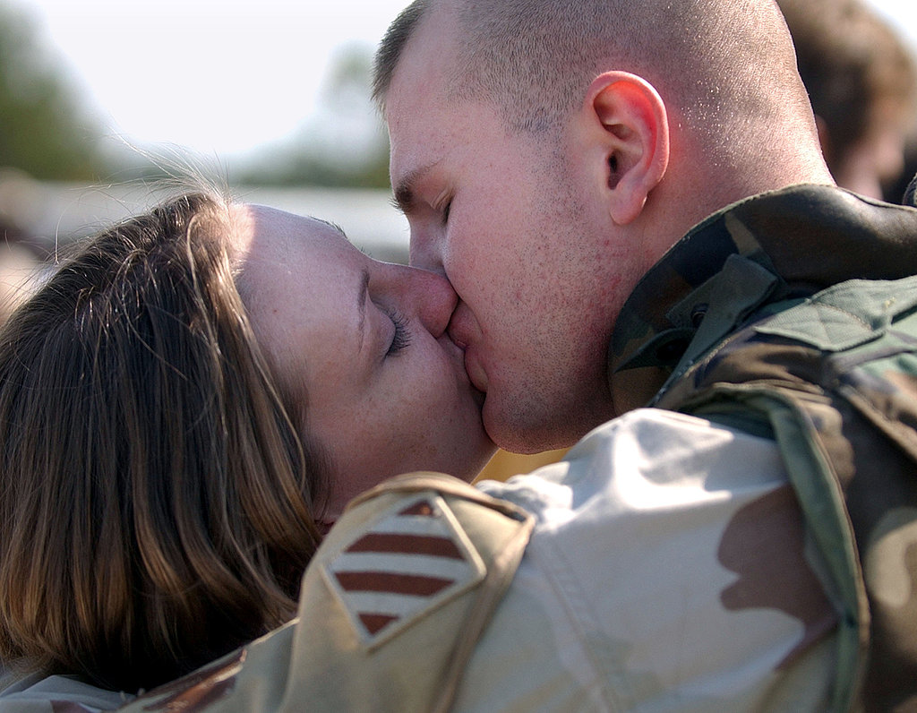 Sgt. William Frizzell kisses his wife, Amy, in February 2005, during a homecoming celebration for 150 soldiers from the Army's Third Infantry Division in Georgia.
Sgt. William Frizzell kisses his wife, Amy, in February 2005, during a homecoming celebration for 150 soldiers from the Army's Third Infantry Division in Georgia.