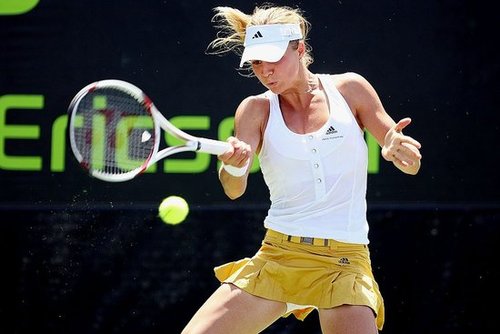 Maria Kirilenko looked sporty yet chic in Adidas by Stella McCartney in her white button down, sleeveless shirt tucked neatly into her belted yellow leather skirt.
Maria Kirilenko looked sporty yet chic in Adidas by Stella McCartney in her white button down, sleeveless shirt tucked neatly into her belted yellow leather skirt.