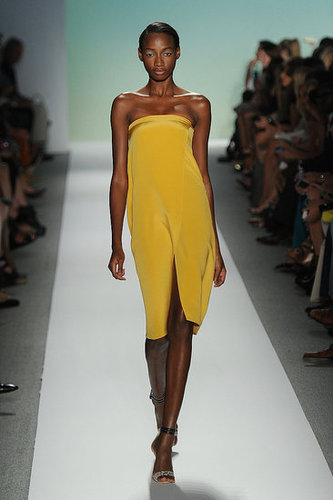 Tibi's gorgeous, citrus-hued strapless offers the minimalist play on sexy style.
Tibi's gorgeous, citrus-hued strapless offers the minimalist play on sexy style.