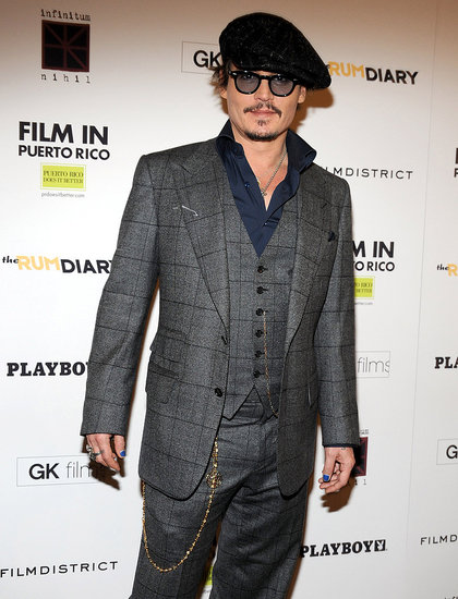 Johnny Depp wore a three-piece suit to the premiere. Johnny Depp wore a three-piece suit to the premiere.