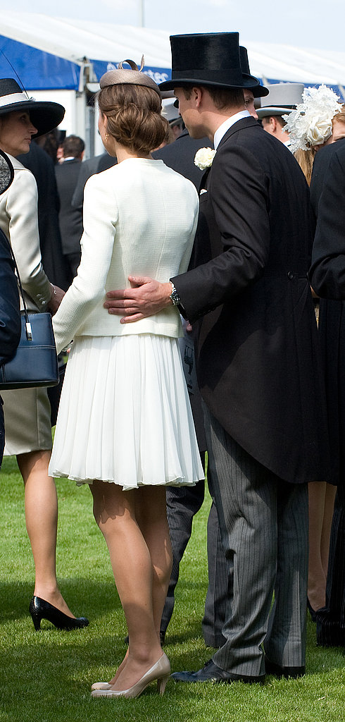 William put his arm around Kate during a day at the races in June 2011.
William put his arm around Kate during a day at the races in June 2011.