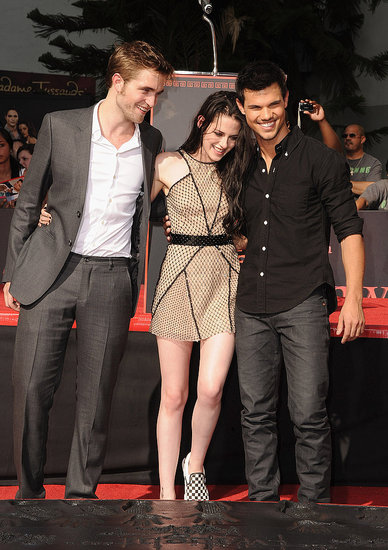 Kristen Stewart, Robert Pattinson, and Taylor Lautner were together at Grauman's Chinese Theater. Kristen Stewart, Robert Pattinson, and Taylor Lautner were together at Grauman's Chinese Theater.