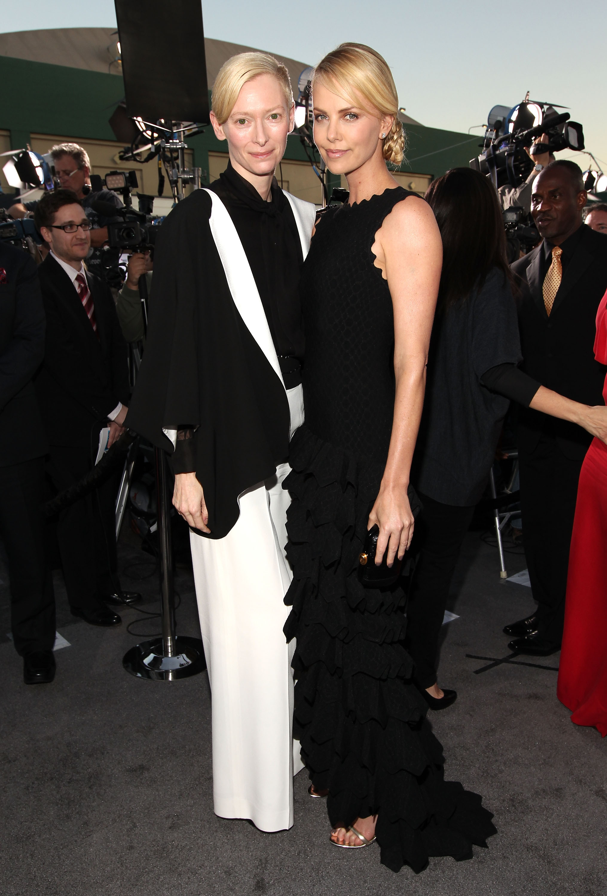Tilda Swinton and Charlize Theron were in black for the 2012 Critics' Choice Movie Awards. Tilda Swinton and Charlize Theron were in black for the 2012 Critics' Choice Movie Awards.