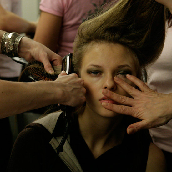 A model gets double the service backstage, sitting for hair and makeup simultaneously.
Photo: Megan Holmes
A model gets double the service backstage, sitting for hair and makeup simultaneously.
Photo: Megan Holmes