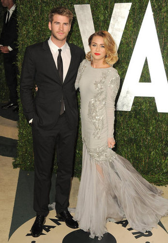 Miley Cyrus and Liam Hemsworth strike a post at Vanity Fair.
Miley Cyrus and Liam Hemsworth strike a post at Vanity Fair.