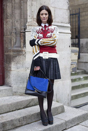 Holy mixing expertise! Between the wide retro white belt, pleated leather skirt, and bright graphic print sweater, we don't know which piece we love best.
Holy mixing expertise! Between the wide retro white belt, pleated leather skirt, and bright graphic print sweater, we don't know which piece we love best.