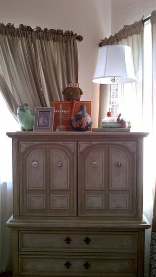 Dresser dressed up with knick knacks in a corner of our living room given the room a comfortable and homey feel. I replaced the knobs with once that I found from various antique stores.