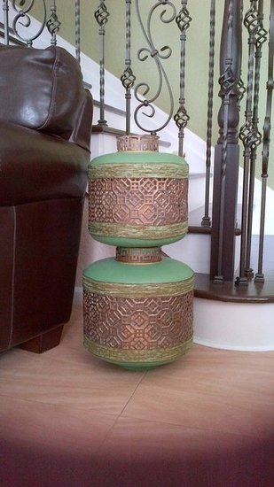 Sconces I embellished with paint, ribbon, and flameless candles help add the perfect ambiance for dinner parties or romantic nights snuggling on the couch.