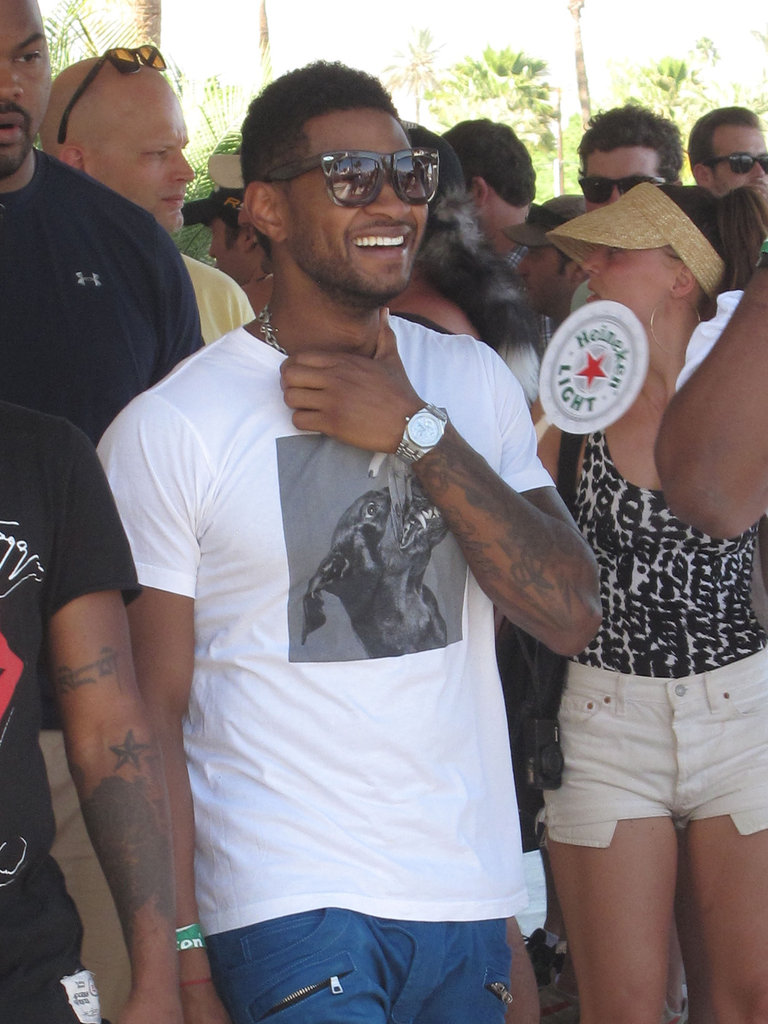 Usher laughed with friends at the festival in 2012.
Usher laughed with friends at the festival in 2012.