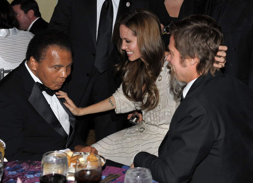 Angelina Jolie chatted with boxing legend Muhammad Ali and stroked Brad Pitt's hair at the December 2009 UNICEF Ball held in Beverly Hills.
Angelina Jolie chatted with boxing legend Muhammad Ali and stroked Brad Pitt's hair at the December 2009 UNICEF Ball held in Beverly Hills.