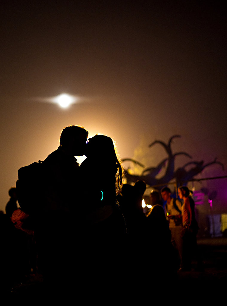 A pair kissed at Glastonbury festival.
A pair kissed at Glastonbury festival.