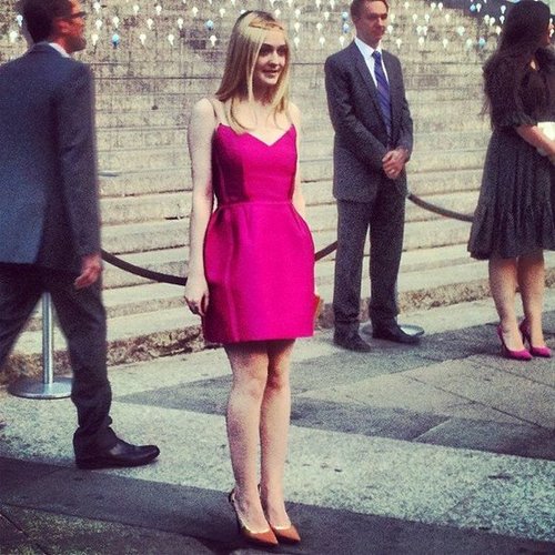 Ever the charming style-setter, Dakota Fanning chose a hot-pink Lanvin number to go with her nude pointy-toe pumps and gold halo. It was even more gorgeous in person.
Ever the charming style-setter, Dakota Fanning chose a hot-pink Lanvin number to go with her nude pointy-toe pumps and gold halo. It was even more gorgeous in person.