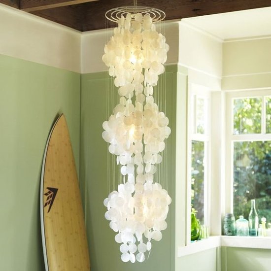 Nothing says glam coastal decor like a capiz shell chandelier. Instead of going for a classic shape, why not go all the way with a stunner like this Capiz Three Tier Chandelier ($200)?
Nothing says glam coastal decor like a capiz shell chandelier. Instead of going for a classic shape, why not go all the way with a stunner like this Capiz Three Tier Chandelier ($200)?