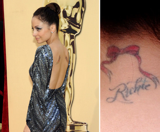Nicole Richie has a red bow tattooed on the back of her neck, along with her last name in a cursive script.
Nicole Richie has a red bow tattooed on the back of her neck, along with her last name in a cursive script.