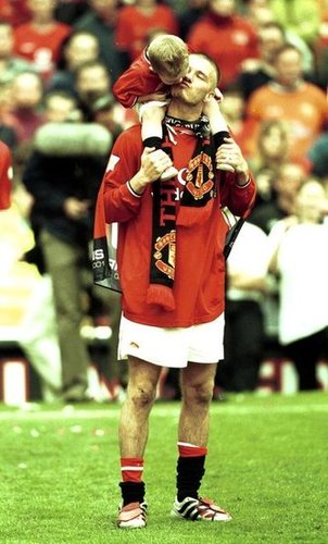 David Beckham, playing for Manchester United, brought his eldest son, Brooklyn, onto the field in April 2001 to celebrate winning the FA Carling Premiership Trophy.
David Beckham, playing for Manchester United, brought his eldest son, Brooklyn, onto the field in April 2001 to celebrate winning the FA Carling Premiership Trophy.