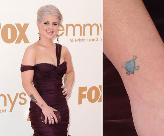 Kelly Osbourne has a tiny blue heart and crossbones tattoo on her right wrist.
Kelly Osbourne has a tiny blue heart and crossbones tattoo on her right wrist.