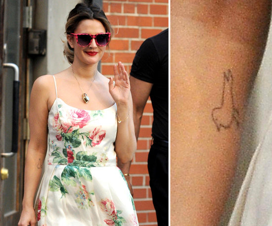 Drew Barrymore has the outline of a little bird tattooed on the inside of her right arm.
Drew Barrymore has the outline of a little bird tattooed on the inside of her right arm.