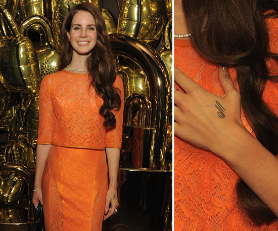 Lana Del Rey has the letter "M" inked on her left hand.
Lana Del Rey has the letter "M" inked on her left hand.