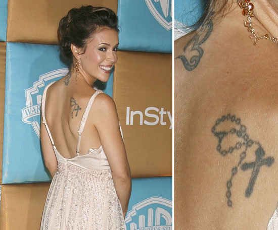 Alyssa Milano has two tattoos on her back, a rosary cross and a Buddhist symbol.
Alyssa Milano has two tattoos on her back, a rosary cross and a Buddhist symbol.