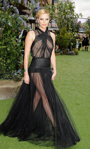 Charlize's dramatic arrival showed off her stems through the see-through sheer skirt.
Charlize's dramatic arrival showed off her stems through the see-through sheer skirt.