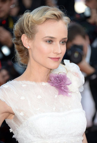 Diane Kruger wore a pretty floral boutonniere at the neckline of her ethereal white gown.
Diane Kruger wore a pretty floral boutonniere at the neckline of her ethereal white gown.