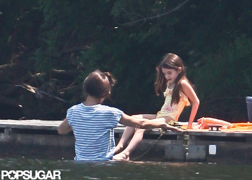 Katie Holmes helped Suri Cruise into the pond.
Katie Holmes helped Suri Cruise into the pond.