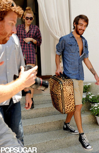 Miley Cyrus and her friend Cheyne Thomas left her Miami hotel.
Miley Cyrus and her friend Cheyne Thomas left her Miami hotel.