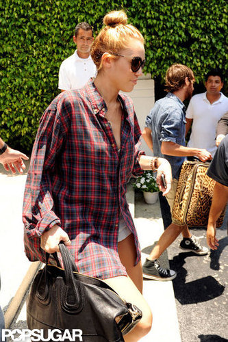 Miley Cyrus got into the car leaving her Miami hotel.
Miley Cyrus got into the car leaving her Miami hotel.