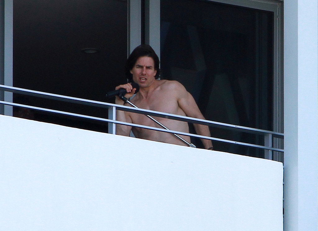 A shirtless Tom Cruise rocked out on his hotel balcony in July 2011.
A shirtless Tom Cruise rocked out on his hotel balcony in July 2011.