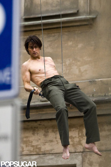 Tom Cruise was shirtless, dangling from a building for the filming of Mission: Impossible — Ghost Protocol in October 2010.
Tom Cruise was shirtless, dangling from a building for the filming of Mission: Impossible — Ghost Protocol in October 2010.