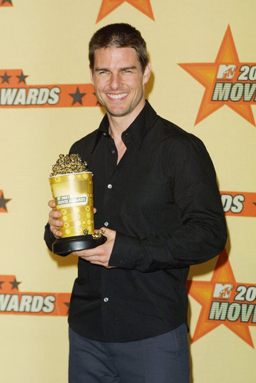Tom Cruise showed off his award-winning smile to accept his golden popcorn at the 2001 MTV Movie Awards.
Tom Cruise showed off his award-winning smile to accept his golden popcorn at the 2001 MTV Movie Awards.