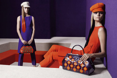 Newsboy caps, boldly printed bags, and even bolder sheaths are staples of Prada's Fall lineup.
Newsboy caps, boldly printed bags, and even bolder sheaths are staples of Prada's Fall lineup.