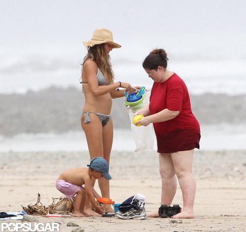 Bikini-clad Gisele Bundchen played in the sand with her son.
Bikini-clad Gisele Bundchen played in the sand with her son.