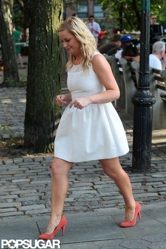 Amy Poehler paired pink shoes with her white dress.
Amy Poehler paired pink shoes with her white dress.