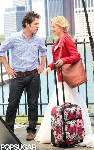 Amy Poehler covered up her wedding dress with a red jacket.
Amy Poehler covered up her wedding dress with a red jacket.