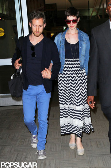 Anne Hathaway arrived in NYC with fiancé Adam Shulman. Anne Hathaway arrived in NYC with fiancé Adam Shulman.