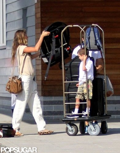 Gisele Bundchen put luggage on a rack also holding Jack Moynahan.
Gisele Bundchen put luggage on a rack also holding Jack Moynahan.
