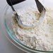 Work until you see coarse dough clumps