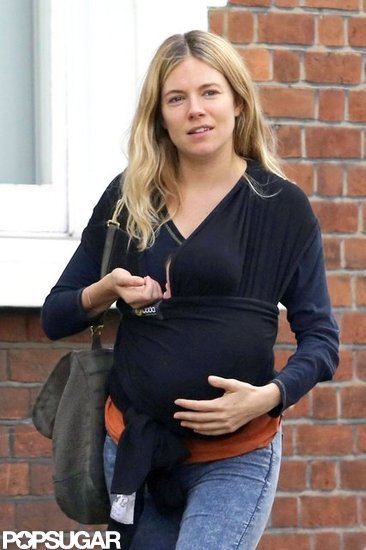 Sienna Miller carried brand new baby Marlowe Sturridge.
Sienna Miller carried brand new baby Marlowe Sturridge.
