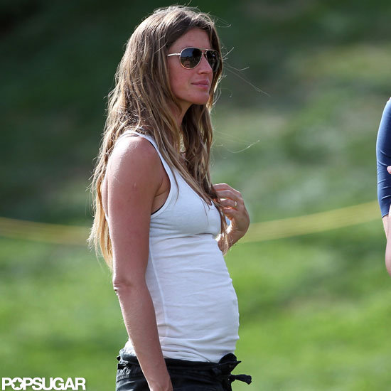 Pregnant Gisele Bundchen showed off her baby bump in a white tank.
Pregnant Gisele Bundchen showed off her baby bump in a white tank.