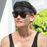 Diane Kruger Pairs Printed Leggings With a Fisherman's Hat Diane Kruger Pairs Printed Leggings With a Fisherman's Hat