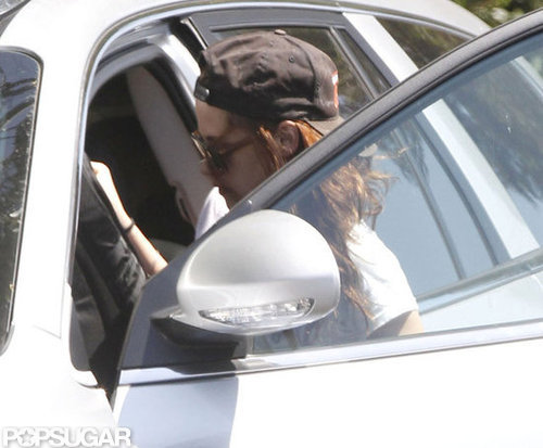 Kristen Stewart wore a black hat.
Kristen Stewart wore a black hat.